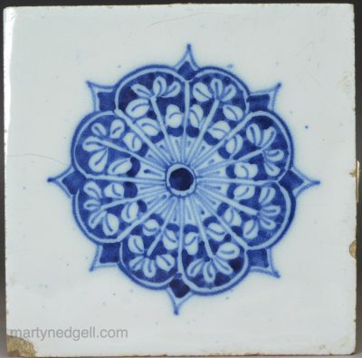 London delft tile painted with a woman in manganese, circa 1750