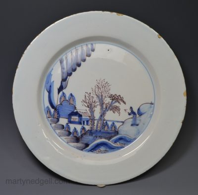 Bristol delft plate decorated with a Chinese man in a landscape in blue and manganese, circa 1750