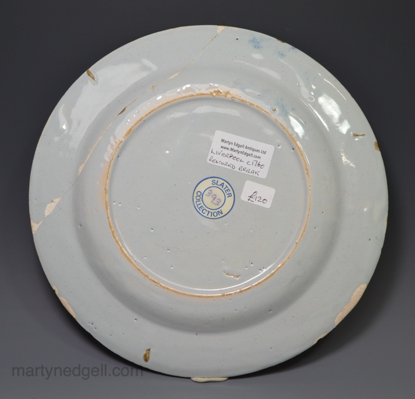 Liverpool delft plate painted with a couple in a rural setting, circa 1750