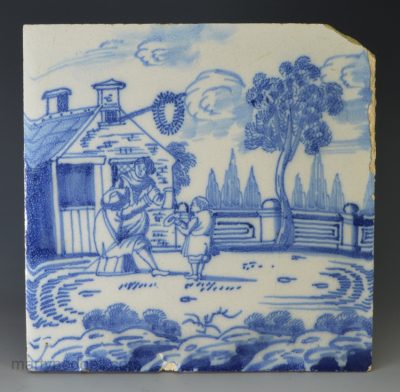 London delft tile of a couple and boy, circa 1730