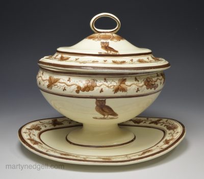 Creamware pottery sauce tureen and stand decorated with an owl crest, circa 1790