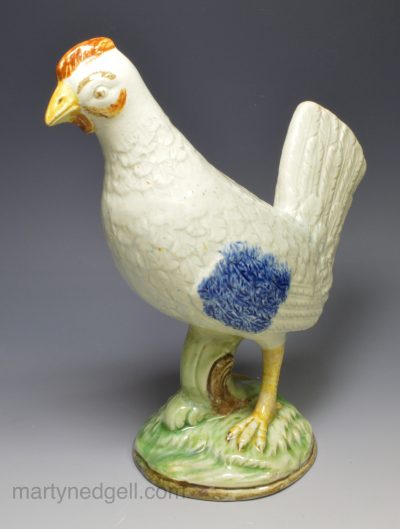Pearlware pottery chicken decorated with colours under the glaze, circa 1820