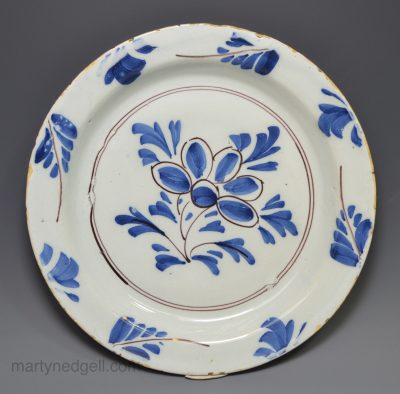 London delft plate pancake decorated in blue and manganese, circa 1740