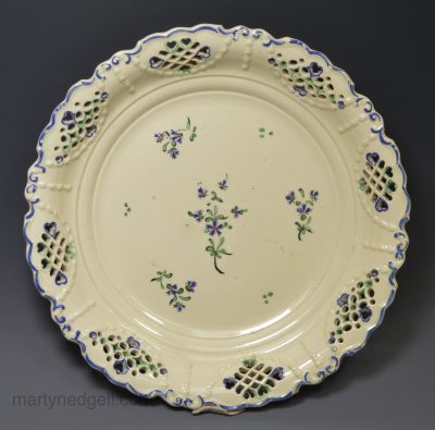 Creamware pierced plate decorated with enamels over the glaze, circa 1800