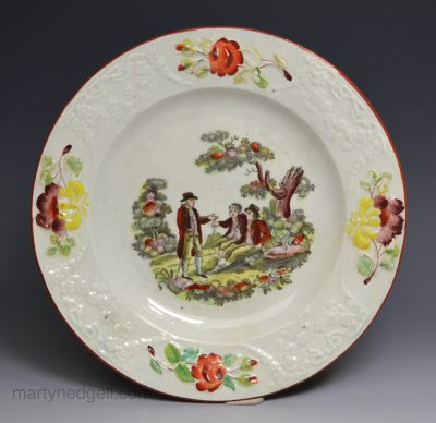 Pearlware pottery child's plate decorated with colour over the glaze, circa 1820, probably Welsh