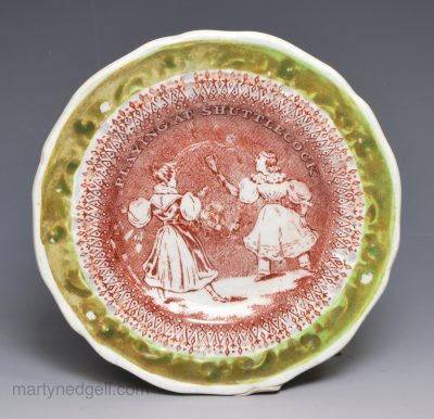 Pearlware pottery child's plate 'PLAYING AT SHUTTLECOCK', circa 1830
