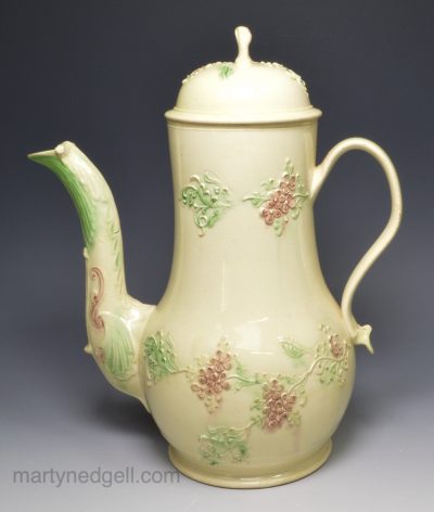 Creamware pottery coffee pot decorated with coloured sprigs under the glaze, circa 1770