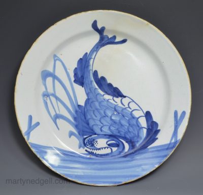 London delft plate painted with a dolphin, circa 1720
