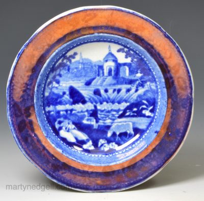 Pearlware pottery cup plate printed with blue transfer and pink lustre border, circa 1820