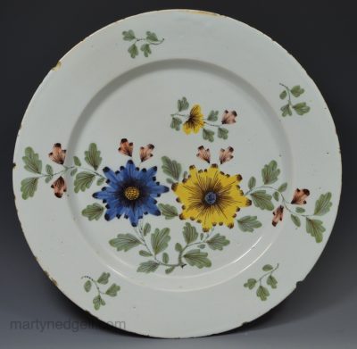Bristol delft charger decorated in the Fazackerly style, circa 1750