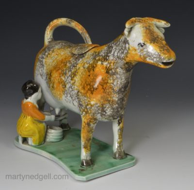 Prattware pottery hobbled cow creamer, circa 1820