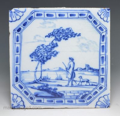 Liverpool delft tile decorated with a man and dog, circa 1760