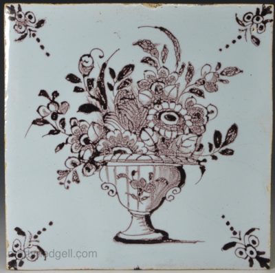 London delft tile painted with flowers in manganese, circa 1750