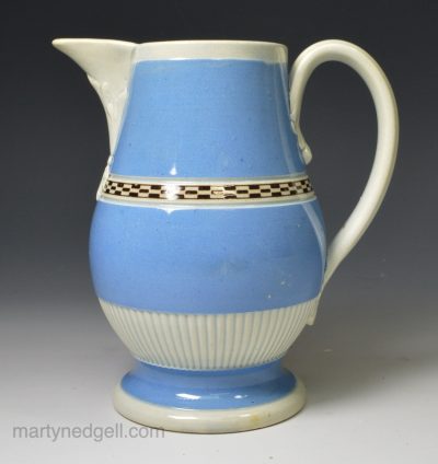 Pearlware pottery jug decorated with blue slip and brown inlay checker, circa 1800