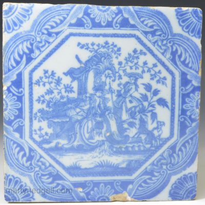 Liverpool delft tile decorated with a Sadler wood block print of a lady and gentleman in hunting costume by rocaille, circa1756-7