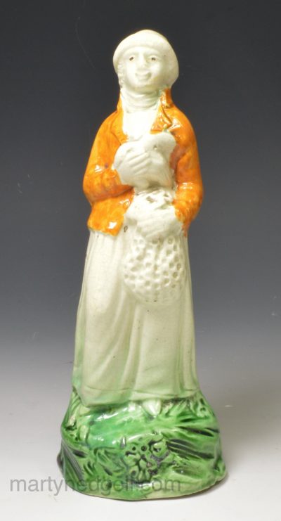 Prattware pottery figure lady holding a goose, circa 1800