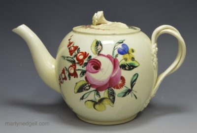 Creamware pottery teapot decorated with colours under the glaze, circa 1770