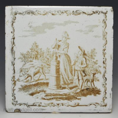 Liverpool delft Sadler printed tile of a woman churning butter, and a boy, circa 1765