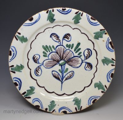 London small delft plate decorated in blue, green and dark manganese, circa 1740