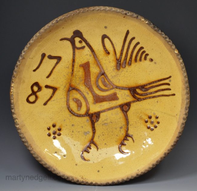 Staffordshire slipware dish with a bird dated 1787