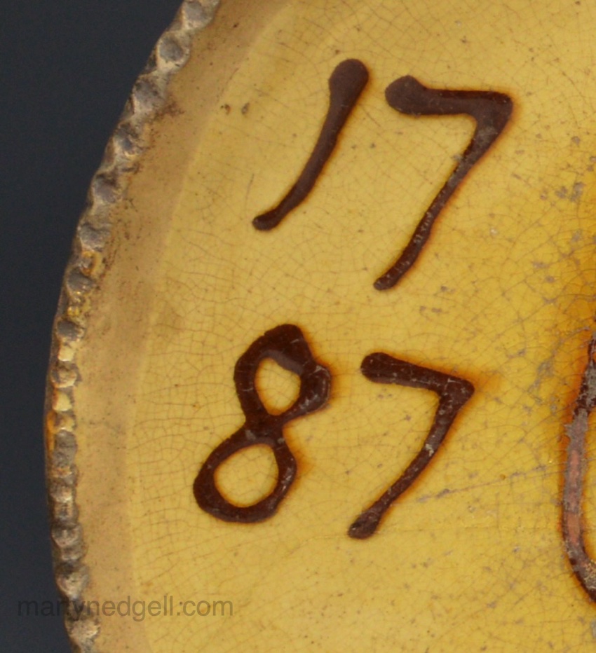 Staffordshire slipware dish with a bird dated 1787