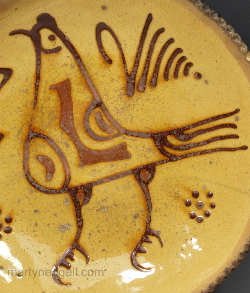 Staffordshire slipware dish with a bird dated 1787