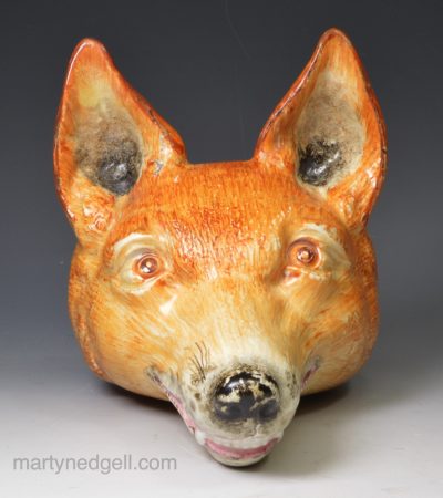 Oversize pearlware pottery fox head stirrup cup, circa 1820