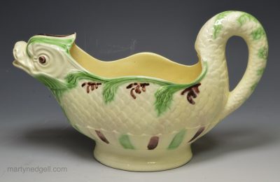 Creamware pottery sauce boat moulded as a dolphin, circa 1780