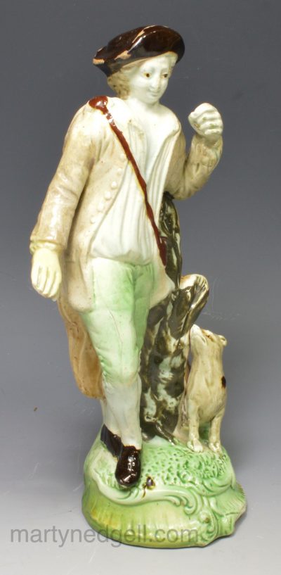 Creamware pottery Ralph Wood type figure of and man and dog, circa 1795