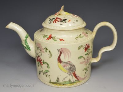 Creamware pottery teapot decorated with two exotic birds, circa 1770