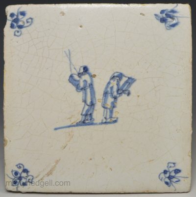 Dutch Delft tile decorated with two people in blue, circa 1700