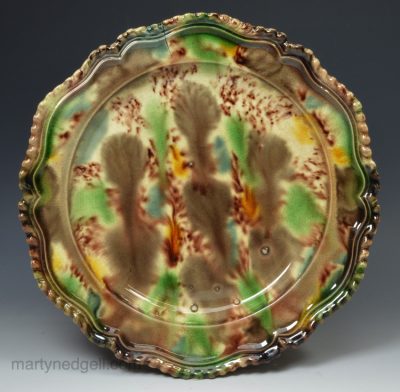 Creamware pottery plate decorated with Whieldon type colours, circa 1770