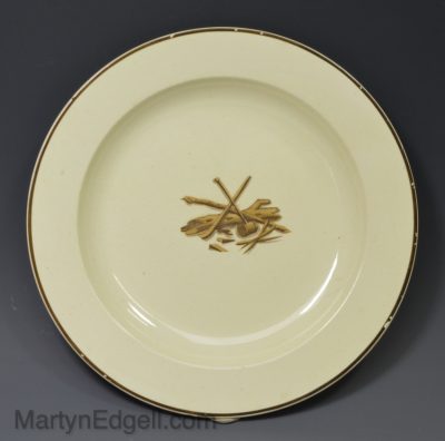Wedgwood creamware plate decorated with tree cutting implements, circa 1810