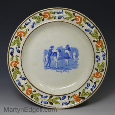 Prattware pottery plate decorated with a blue transfer print of 'Leapfrog', circa 1820