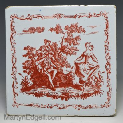 Liverpool delft tile decorated with a Sadler print in red of Nancy Dawson dancing the Hornpipe, circa 1760