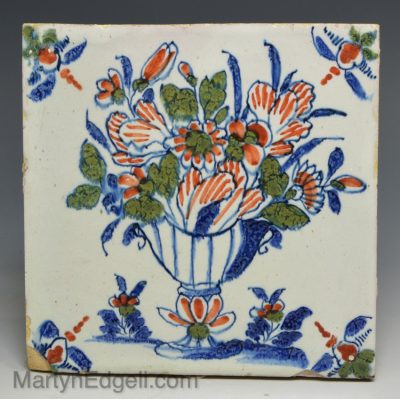 London delft tile painted in blue, red and green, circa 1730