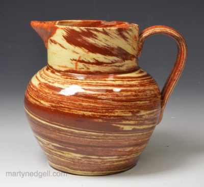 Small solid agateware pottery jug, circa 1840