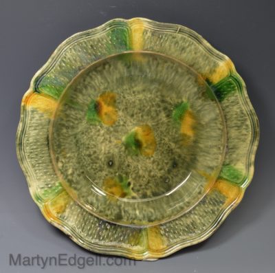 Creamware plate decorated with Whieldon type colours under the glaze, circa 1770