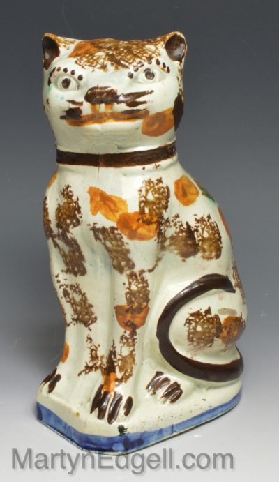 Prattware pottery figure of a cat on a pearlware body, circa 1800