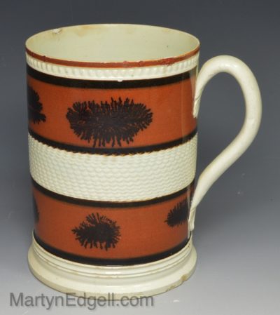 Pearlware pottery mug decorated with slip and dendritic mochaware markings, circa 1820
