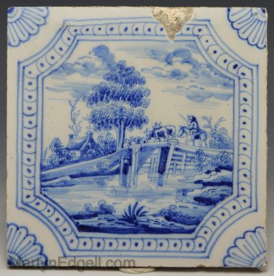 Dutch Delft tile decorated with a farmer and his cattle, circa 1750
