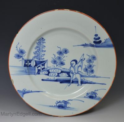 Liverpool delft plate decorated with a man fishing, circa 1740