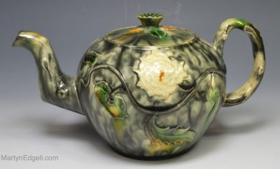 Creamware pottery teapot decorated with Whieldon type colours under the glaze, circa 1770