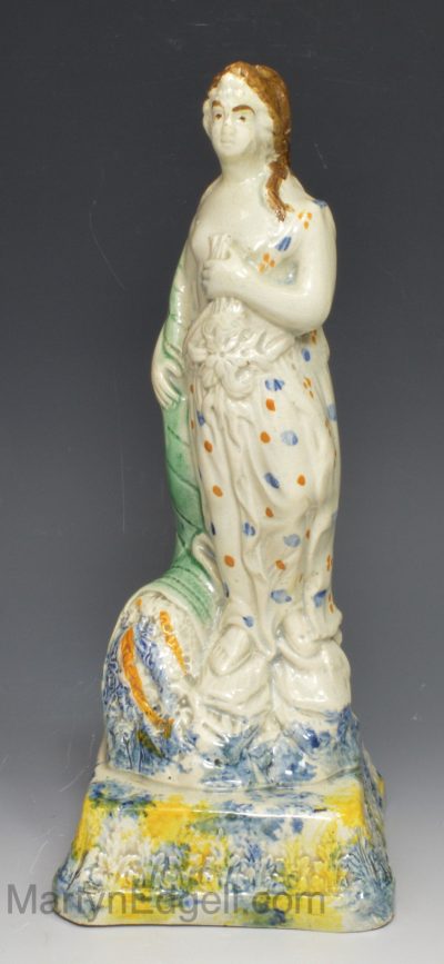Prattware pottery figure of a lady on a pearlware base, circa 1800