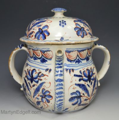 London delft posset pot decorated in red and blue florals, circa 1730