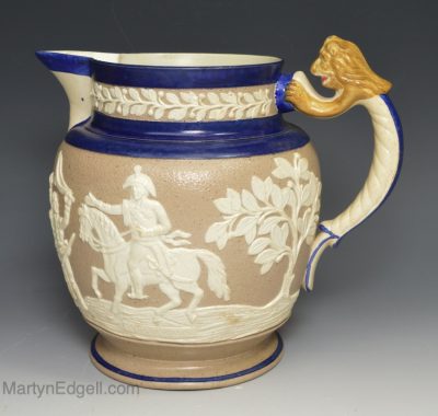 Pearlware pottery jug commemorating peninsular war moulded with the Duke of Wellington, circa 1814