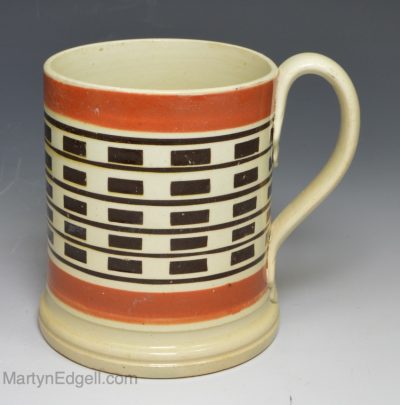 Small pearlware mug decorated with inlaid brown slip