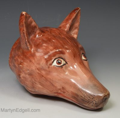 Pearlware pottery fox head stirrup cup, circa 1820