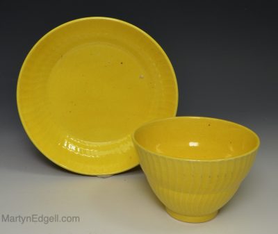 Canary yellow pottery cup and saucer, circa 1830