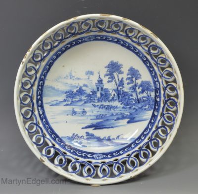 Liverpool delft pierced bowl decorated with a landscape painted in blue, circa 1760